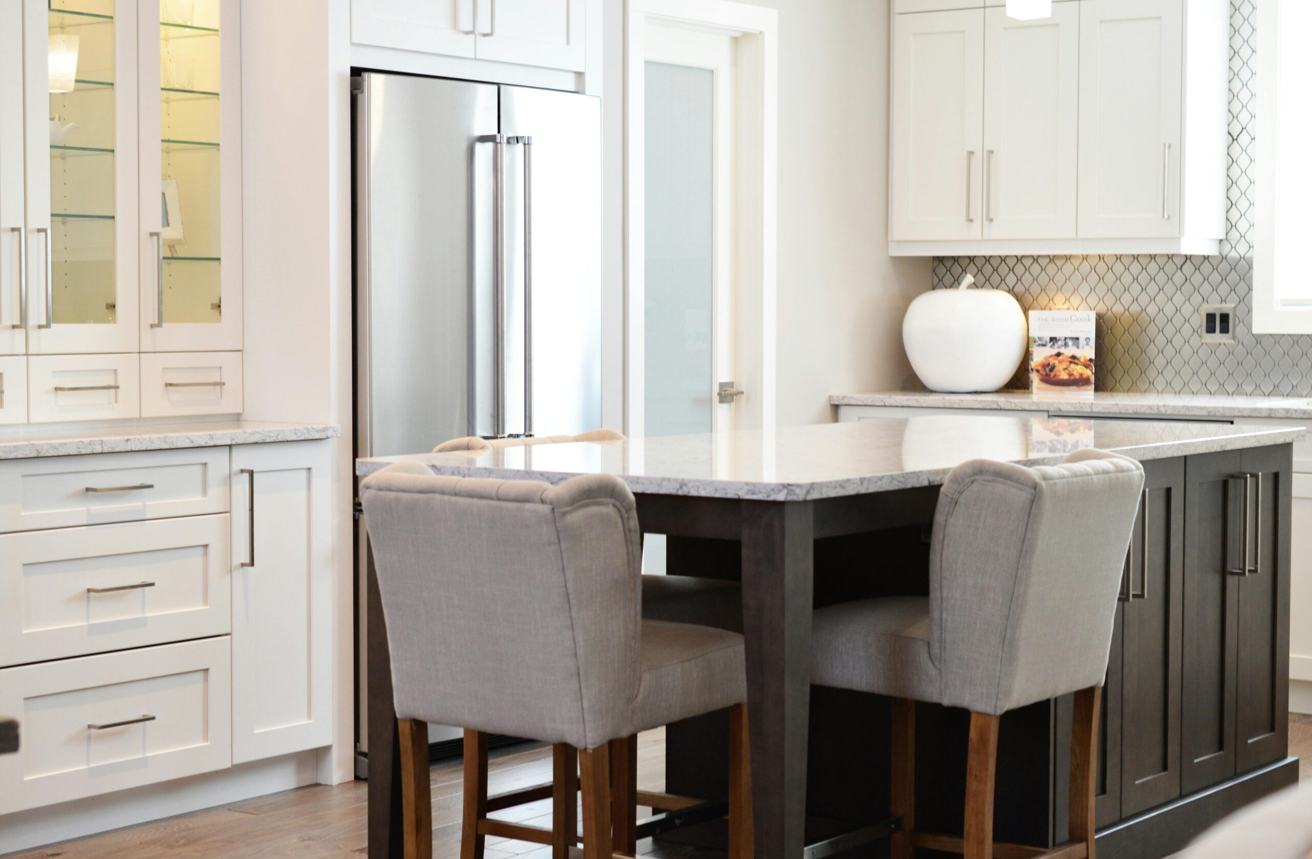 Stylish kitchen interior featuring modern design, island counter and elegant seating.